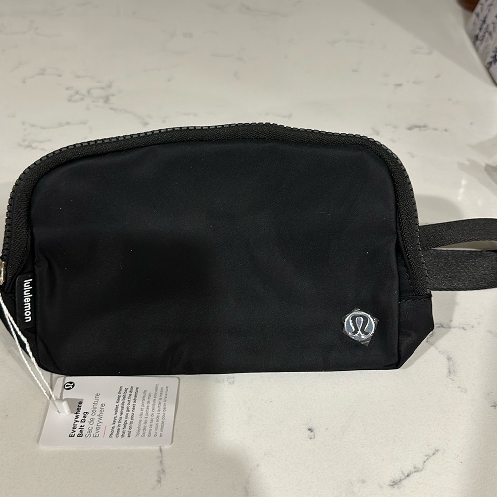 Lululemon athletica everywhere belt bag 
Black 7.5 x5x2inches brand new